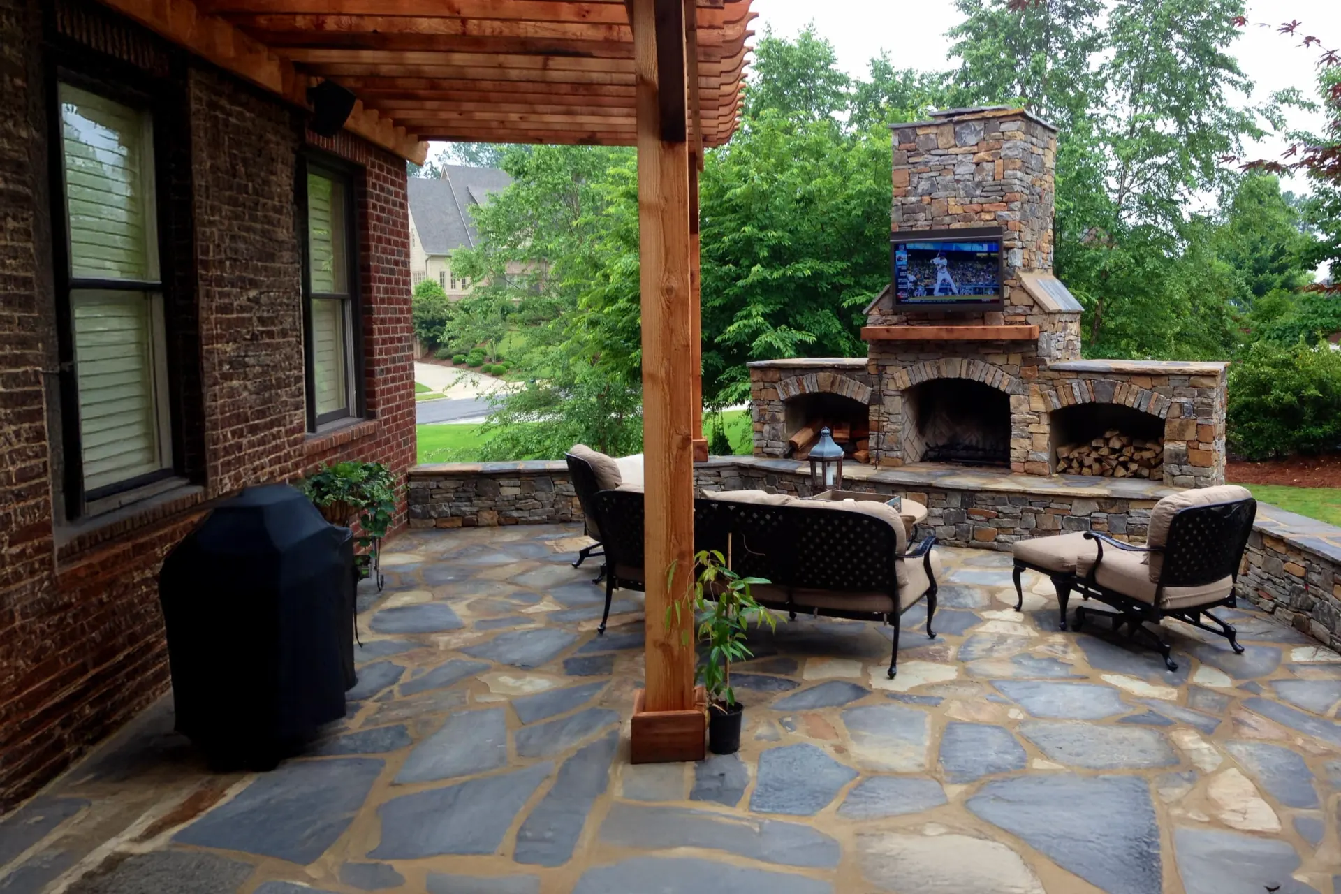Custom stone outdoor fireplace built by Schroeter's